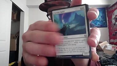 Cute Young Nerd Opening a Pack of Magic the Gathering Cards