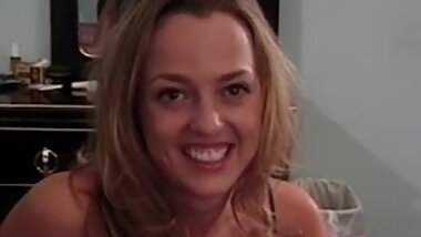 Busty blonde babe slowly strips unveiling her natural boobs