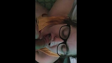 Drinking more piss with her nerdy glasses on.